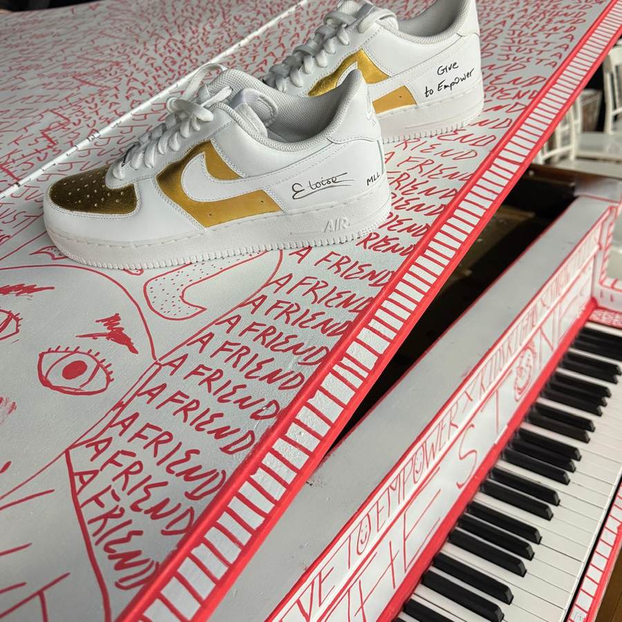 Hand-illustrated grand piano with signed custom sneakers resting on its lid